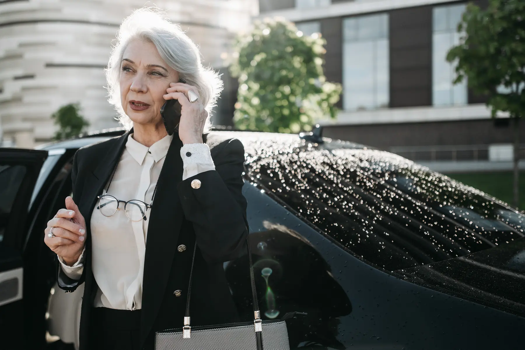 Independent older adult preparing for professional transportation
